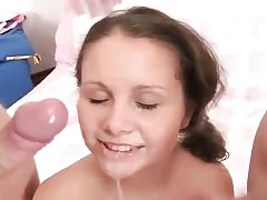 Sexy teen gets two cocks in her mouth